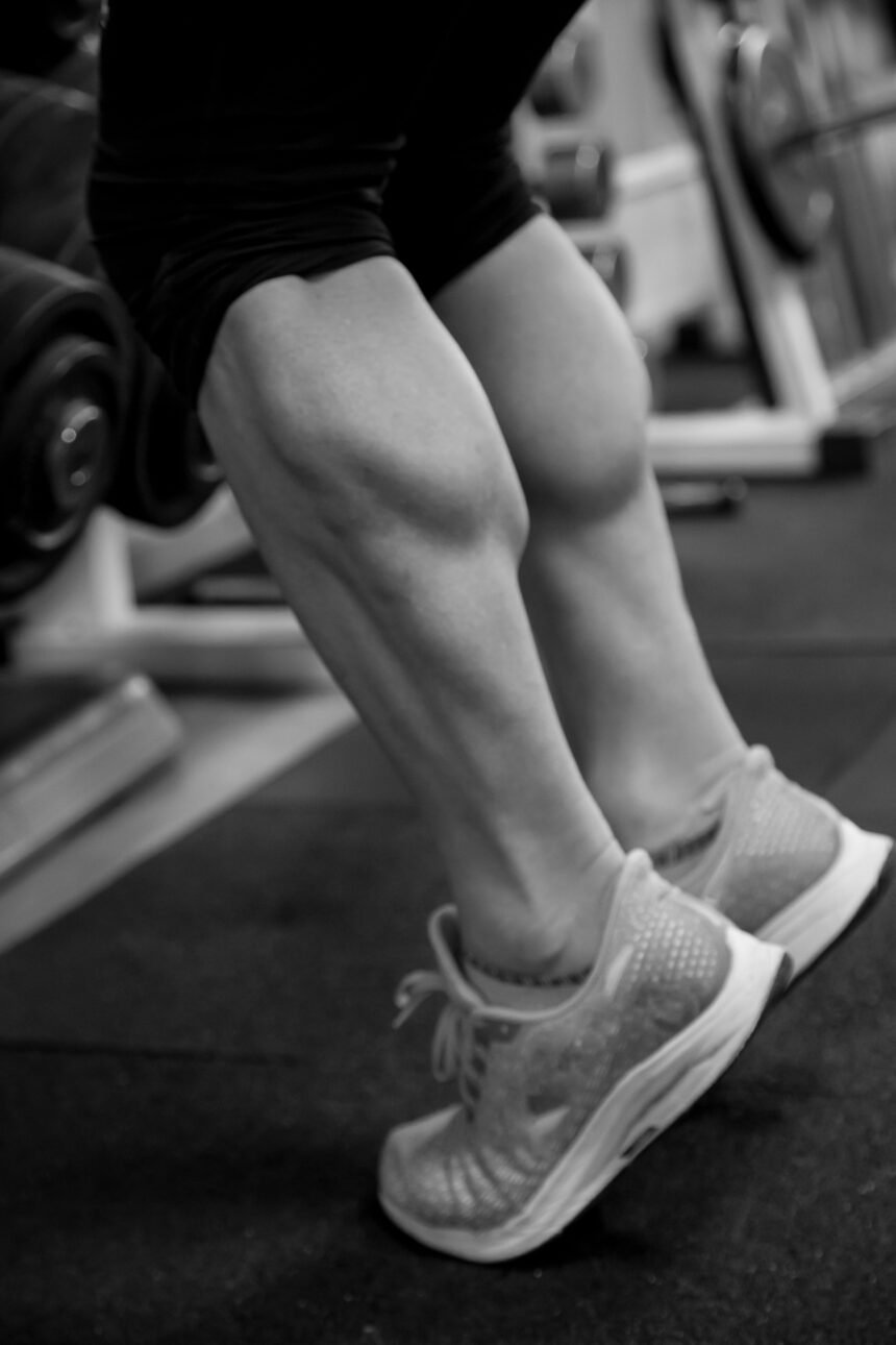 Black and white detail of the calves training in the gym.